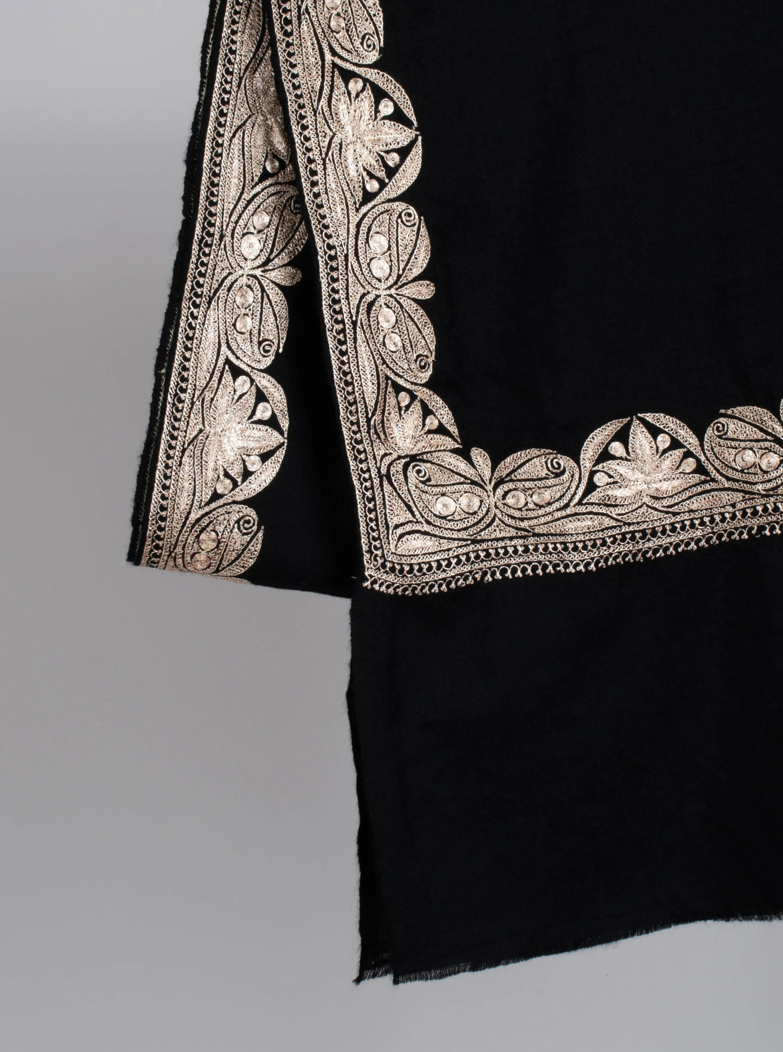 Black Pashmina Wrap adorned with Water Gold Zari Embroidery.